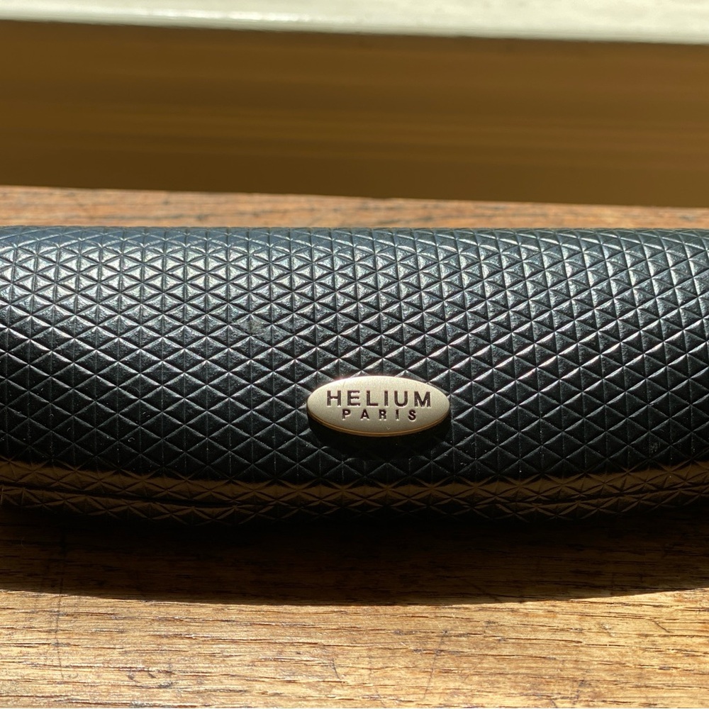 Helium Paris black hard shell quilted case and unbranded sunglasses